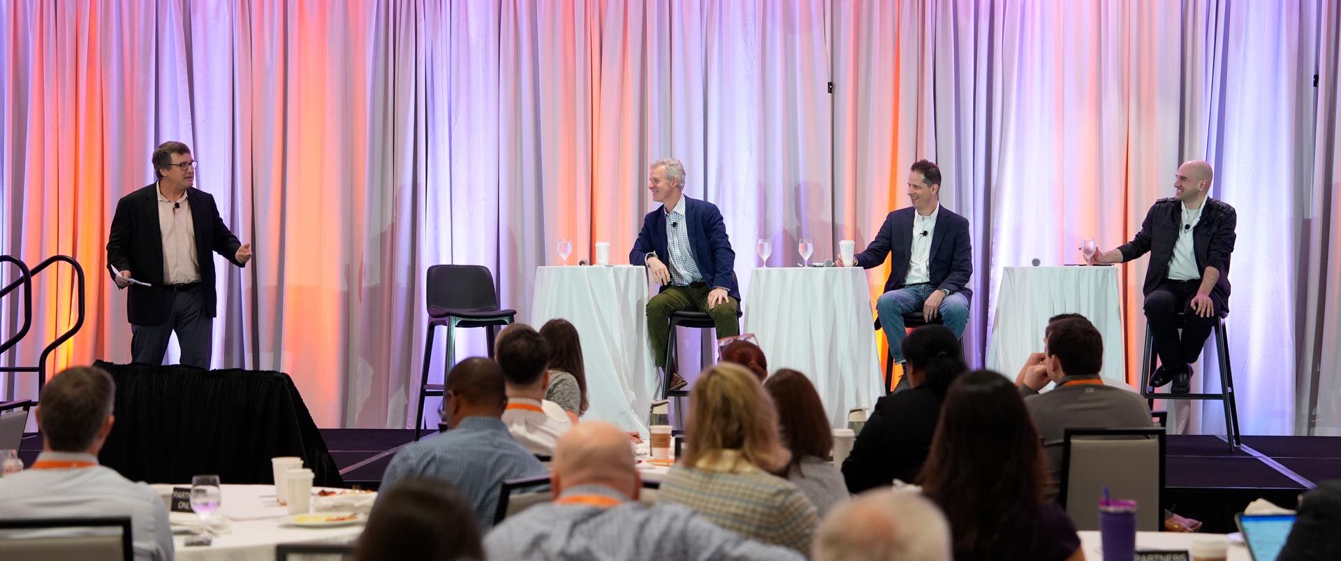 Group of speakers on stage at a Global Supply Chain Institute event