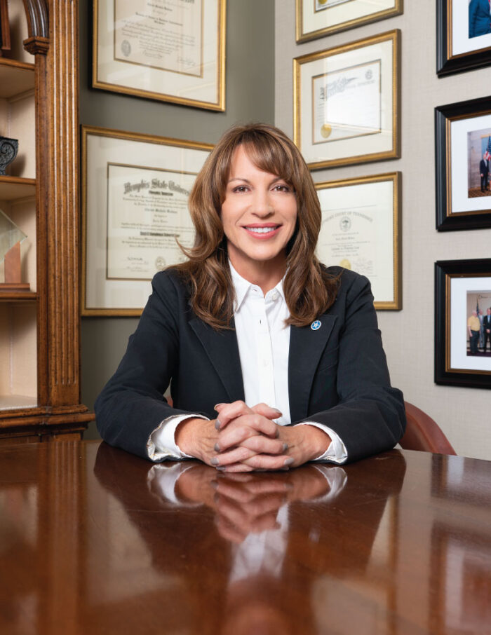 Christi Branscom at desk