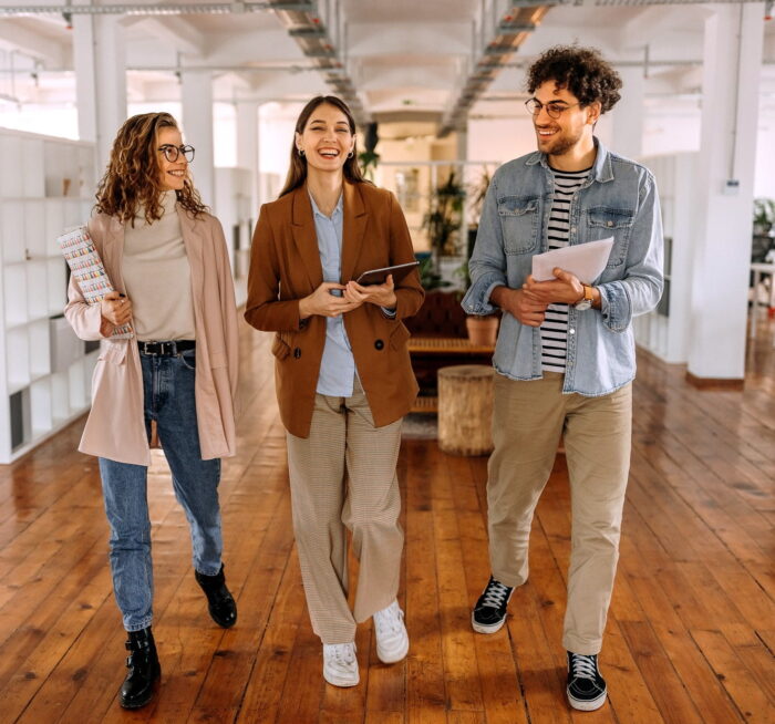 group of young people working in an office