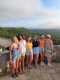 Some of the students pose in front of a scenic view in Cuba.