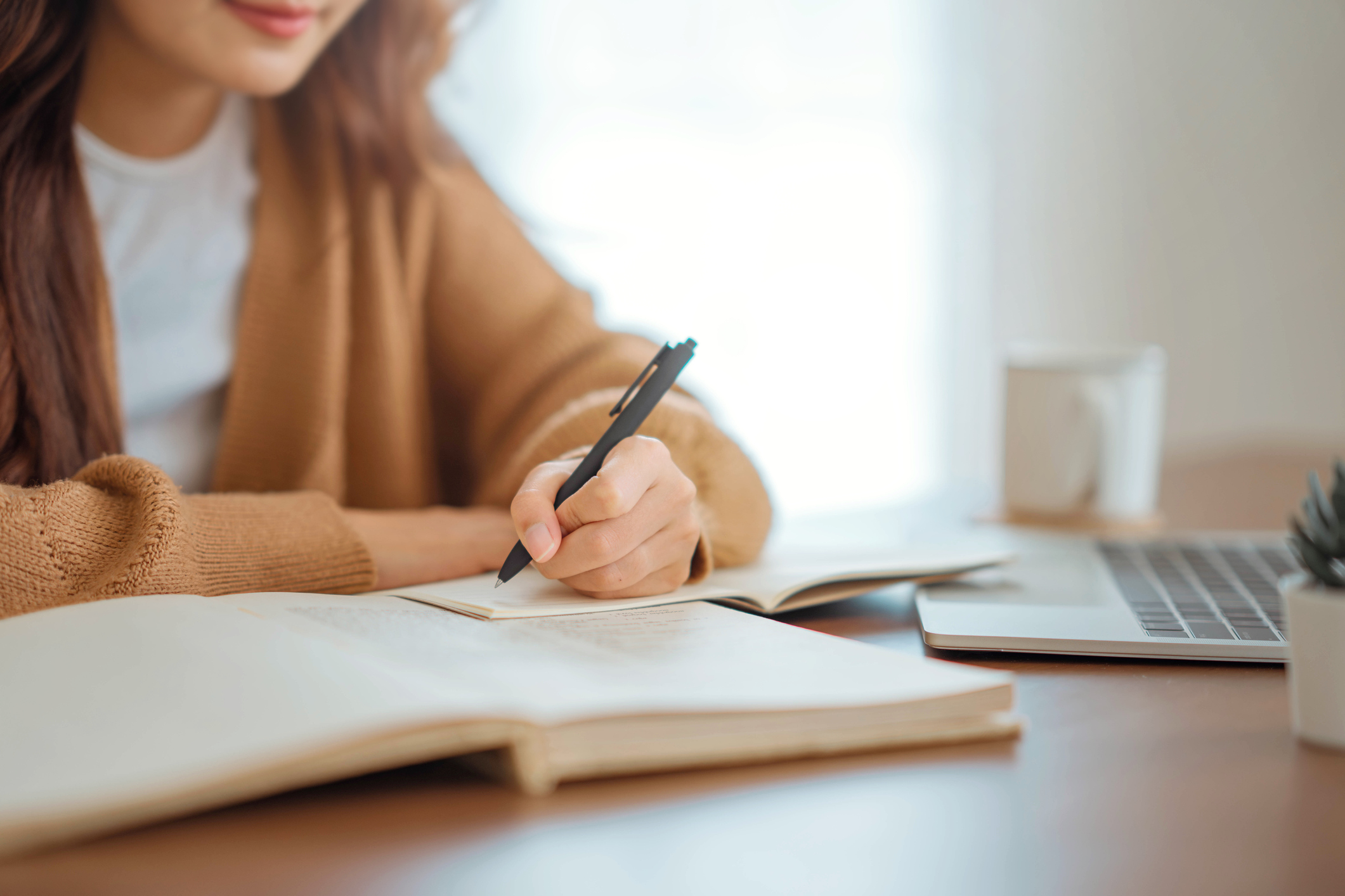 Woman studying with laptop