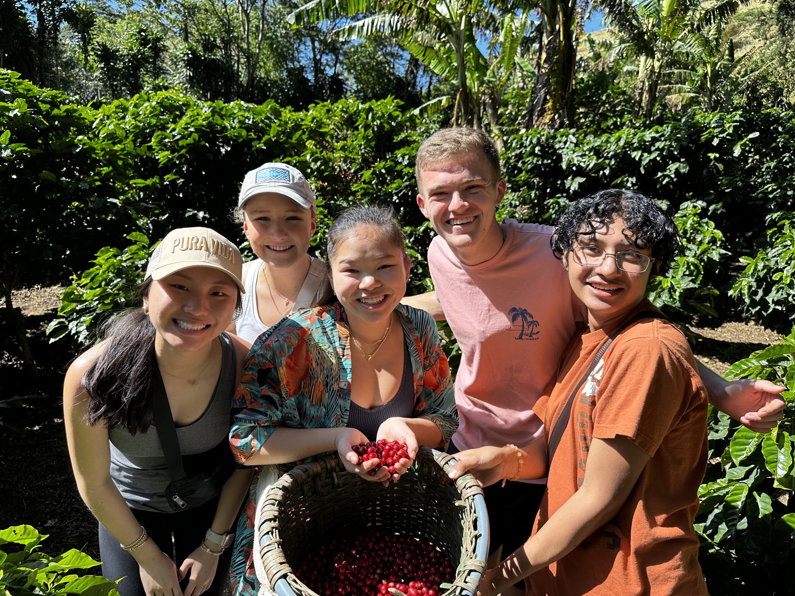 Group of Haslam students with coffee berries