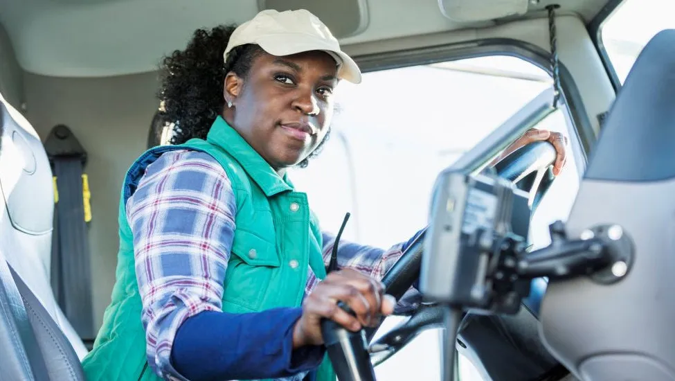 Black female trucker in cream-colored ball cap