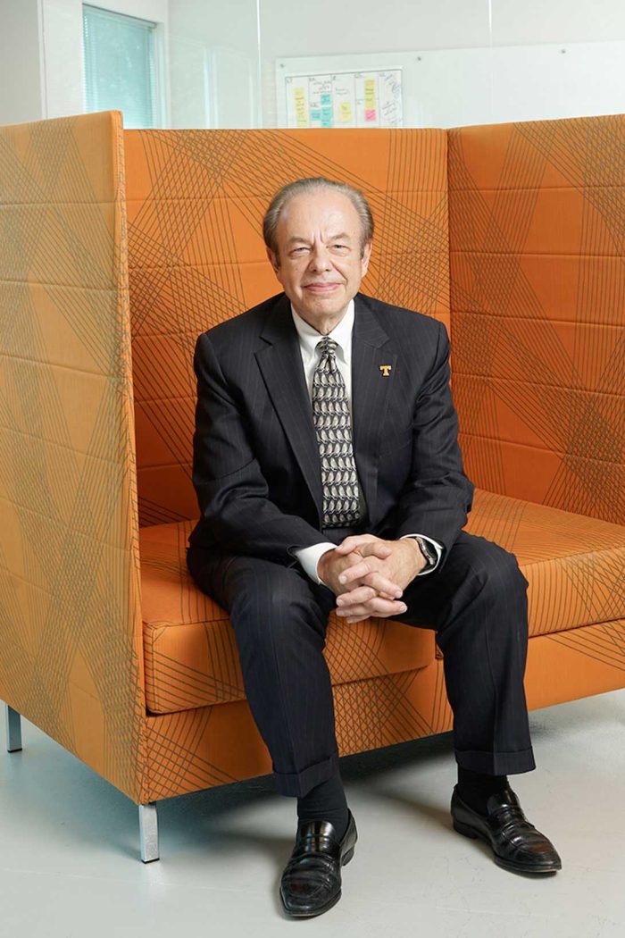 Man Sitting In Big Orange Chair