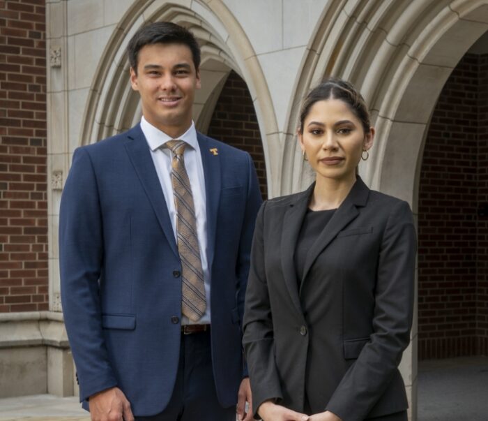 Two professional students standing outside Haslam Business Building