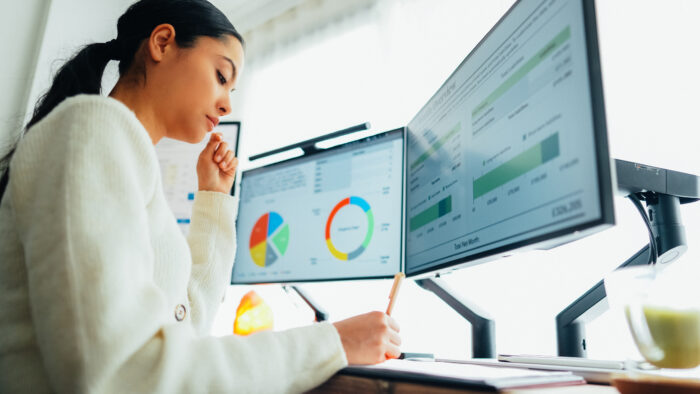 Woman With Back Pain Working At Standing Desk Home Office