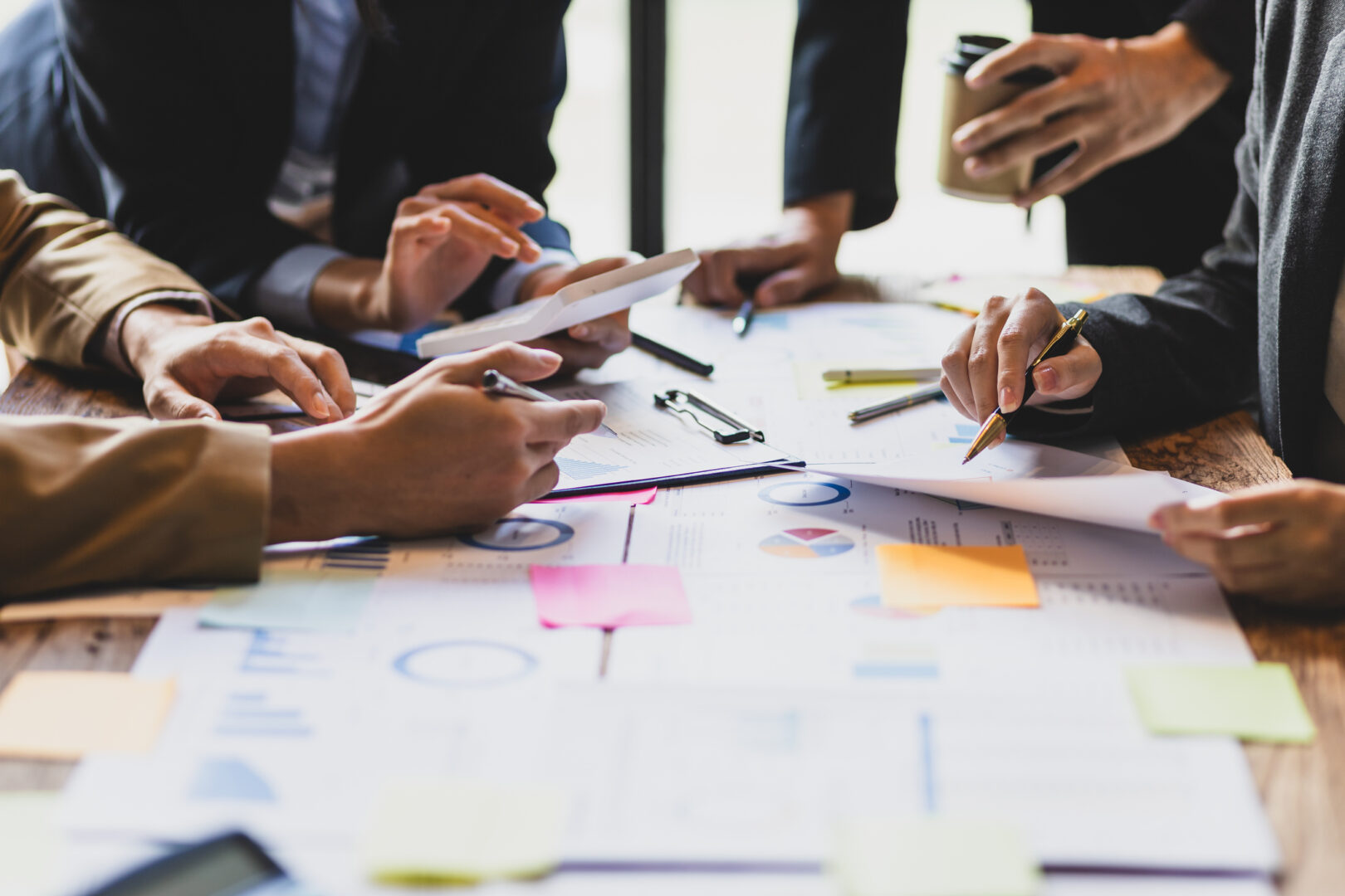 Brainstorm Business Meeting To Discuss Analysis Of Financial Figures, Graphs And Growth Charts Of Business Investments To Plan New Business Projects