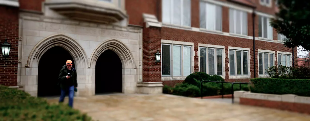 Student outside the Haslam Business Building