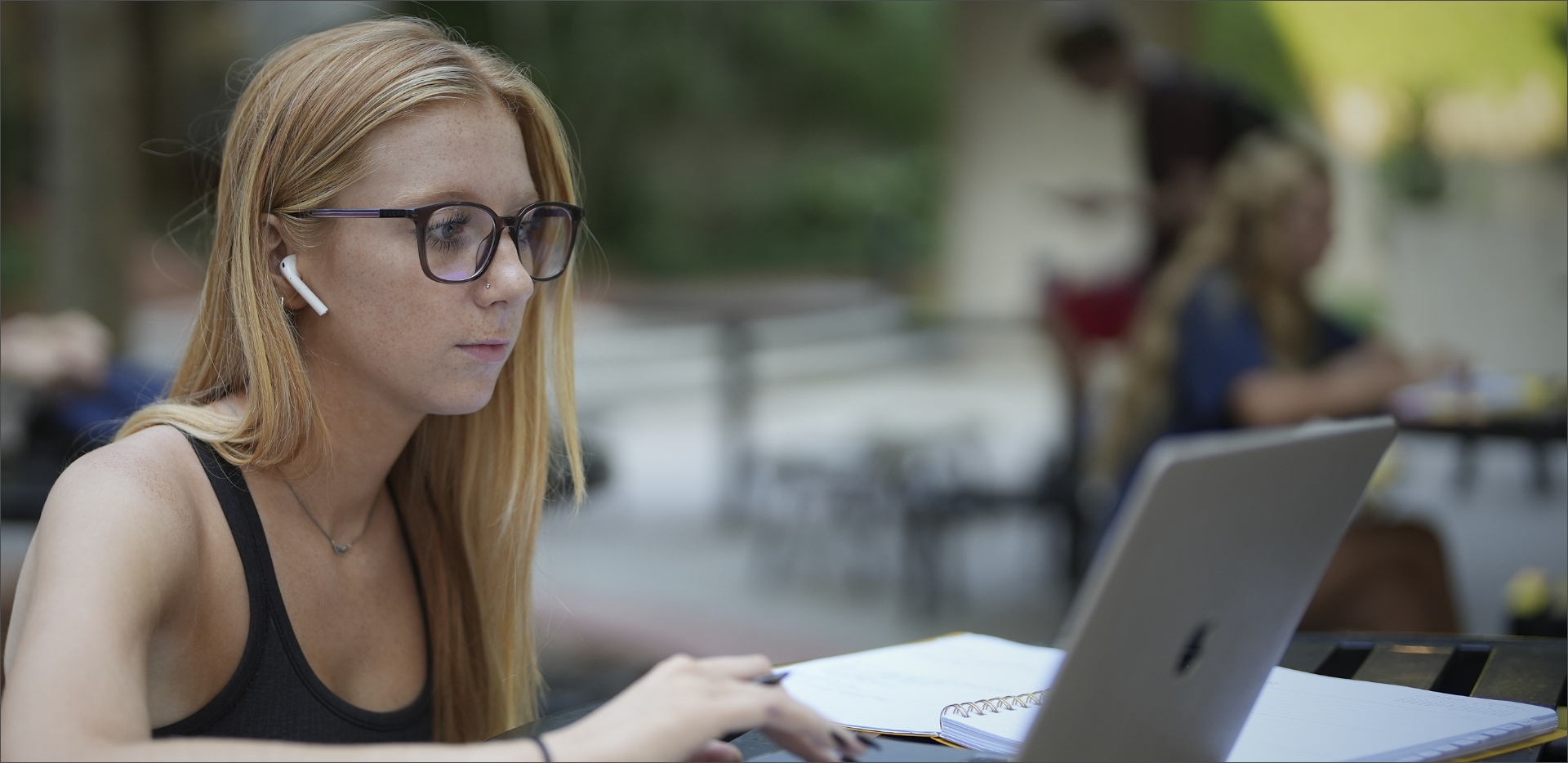 Student Working Outside On Laptop
