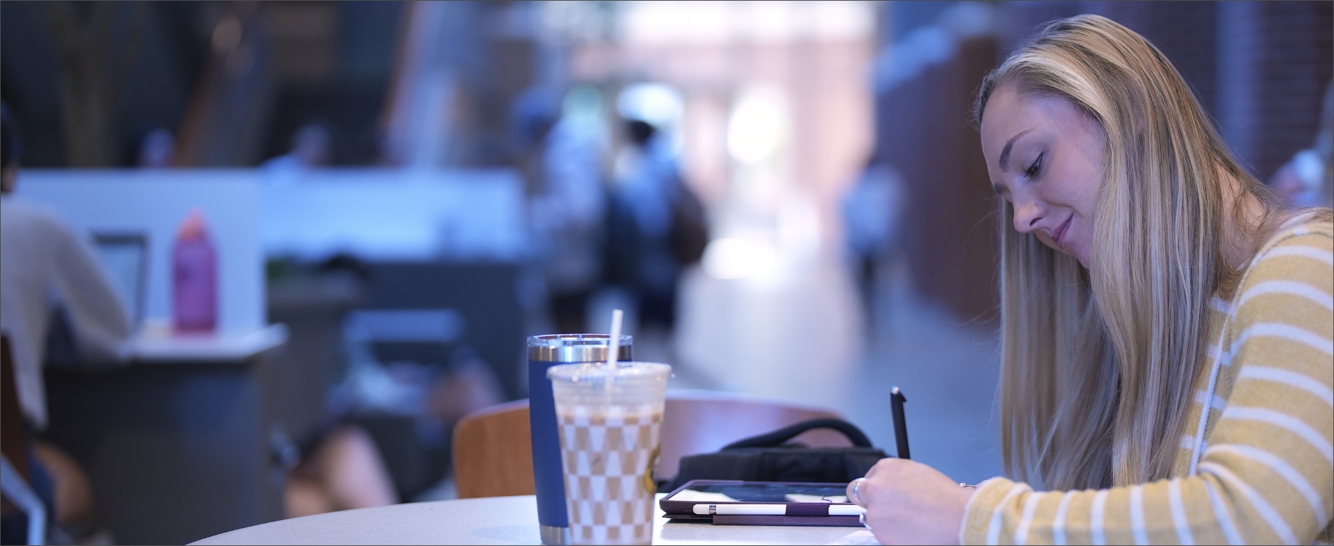 Student Writing At Desk