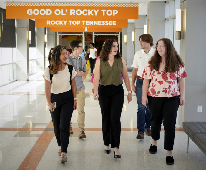 students walking down a hallway