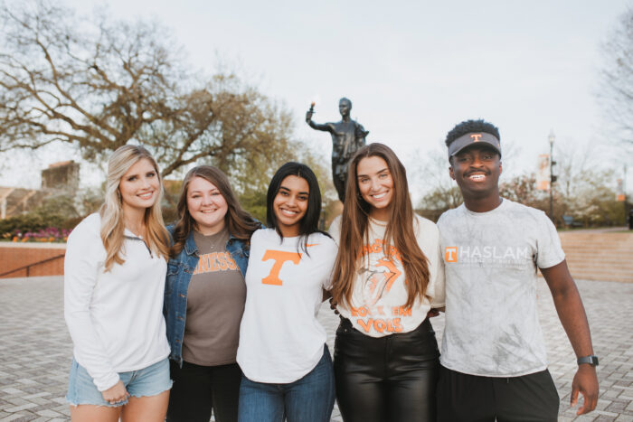 Students in front of Torchbearer statue