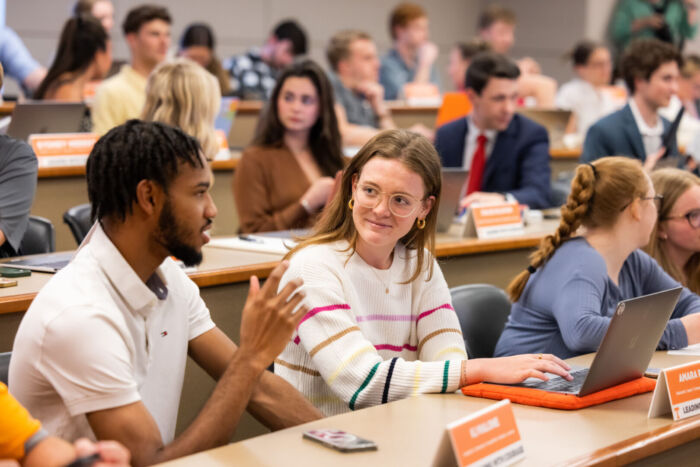 Students visit before their Leading with Courage class inside the Haslam College of Business Building