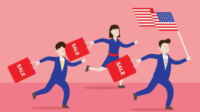 Two male and one female cartoon figures dressed in blue and white suits run against a red background, the lead figure holding aloft a U.S. flag and all carrying bags that say "Sale" on them