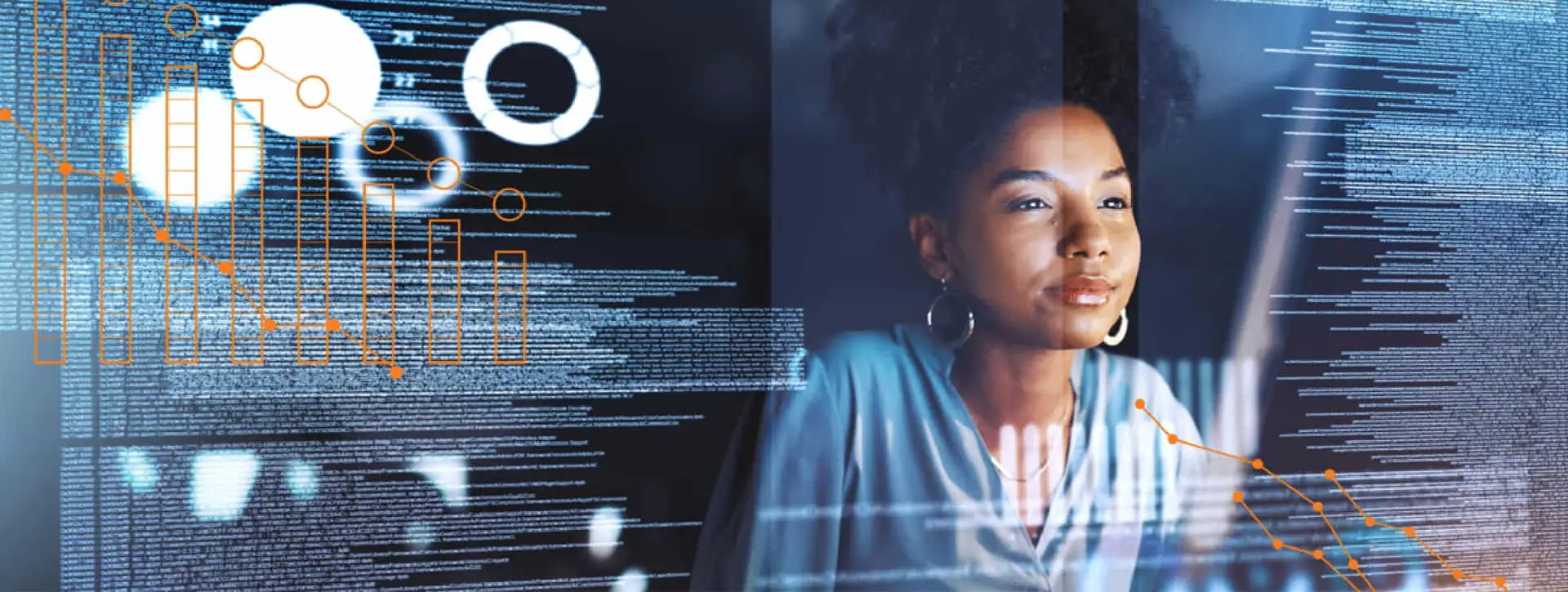 Woman working on a computer with numbers, charts, and graphs