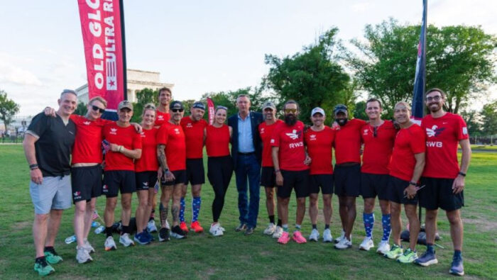 Matt Voll poses with the Old Glory Ultra Relay runners after they completed their run.