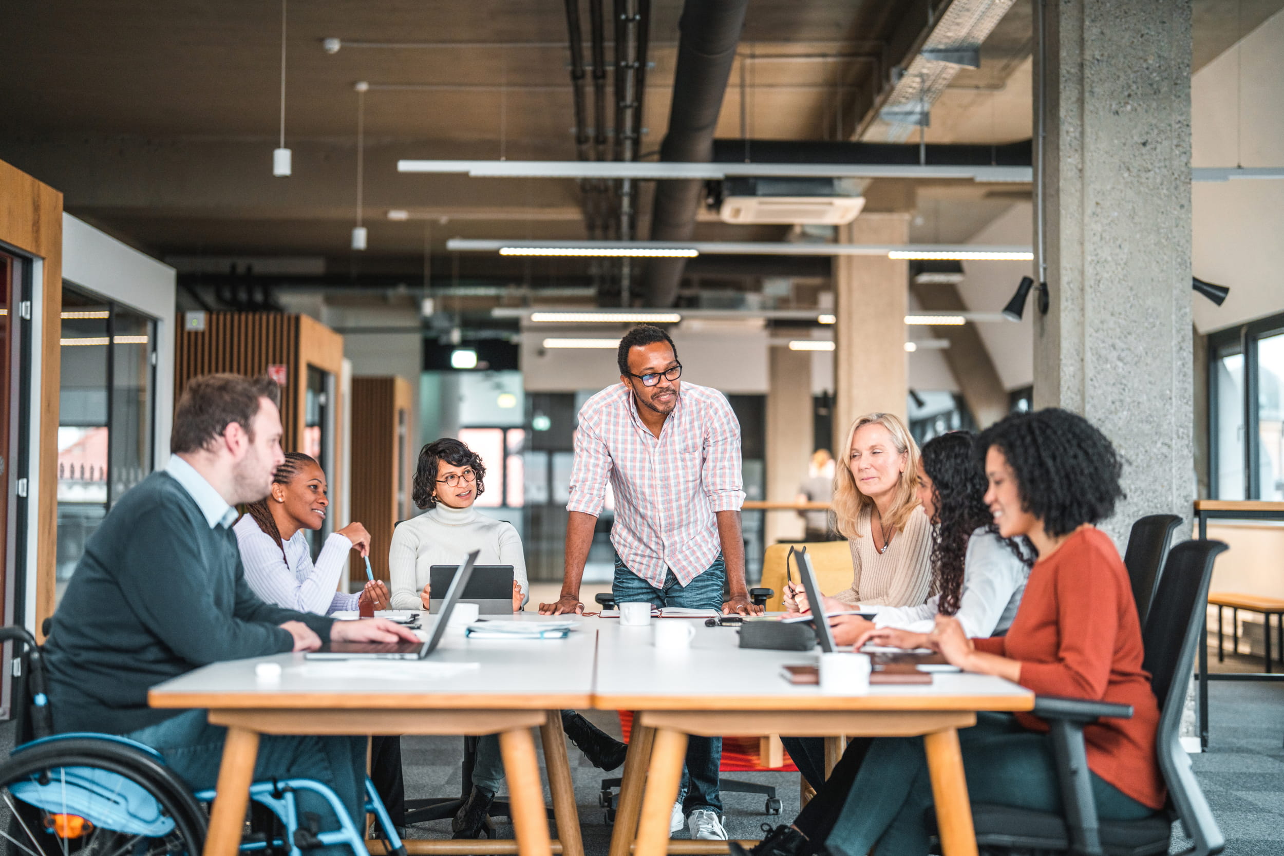 Group of workers around a table during a meeting