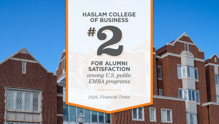 A vertical white banner lined with orange, superimposed in front of the facade of the Haslam Business Building, has the following words in black on it: Haslam College of Business #2 For Alumni Satisfaction among U.S. public MBA programs, 2025, Financial Times