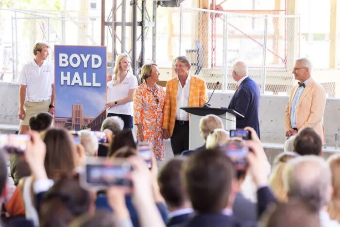 Jenny and Randy Boyd, UT System president; with Stephen Mangum, dean of the Haslam College of Business; and John Zomchick, provost and senior vice chancellor, celebrate the lifting of the final beam during the Haslam College of Business topping off ceremony on April 17, 2026.
