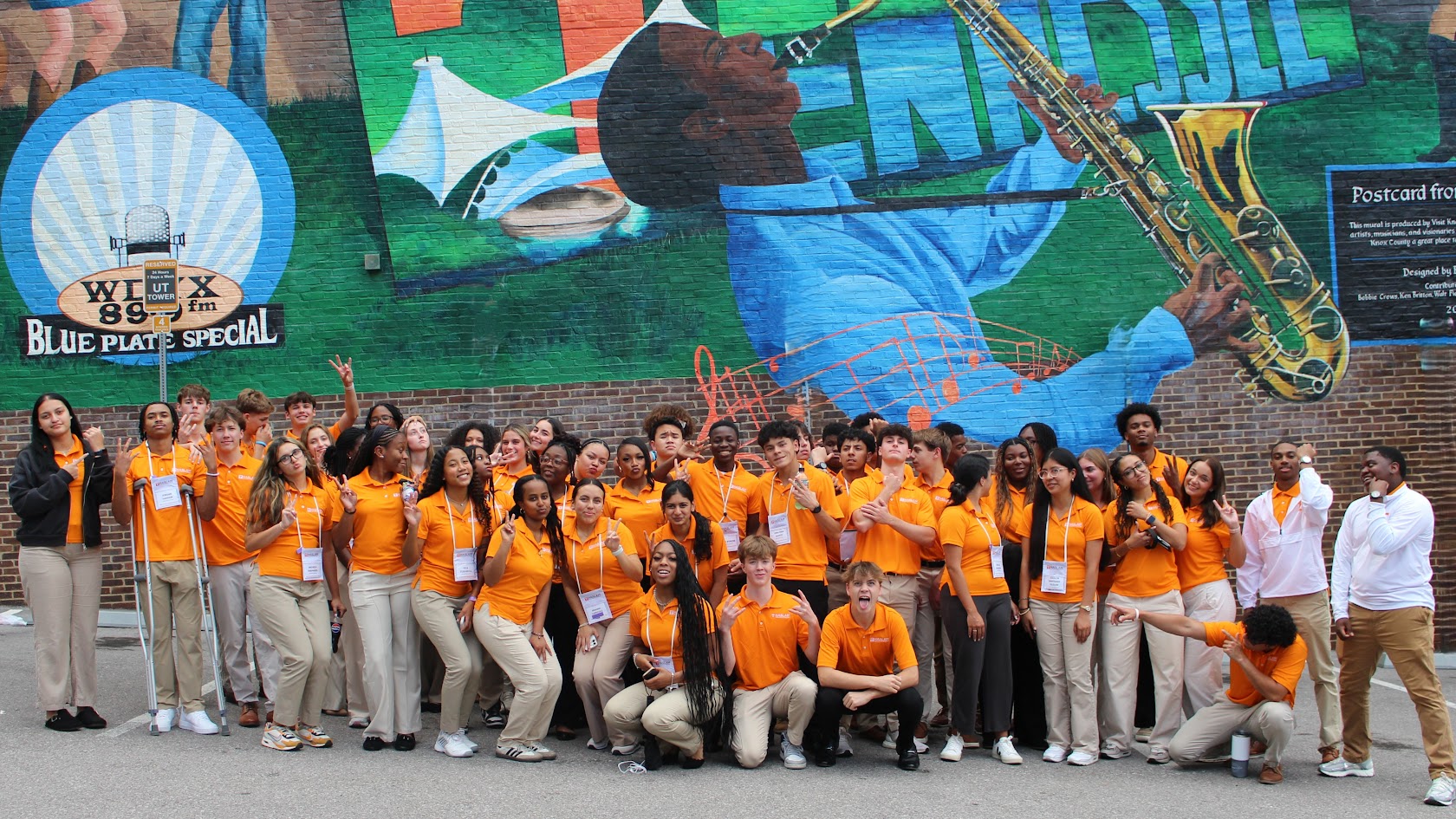 Students standing in front of Knoxville mural