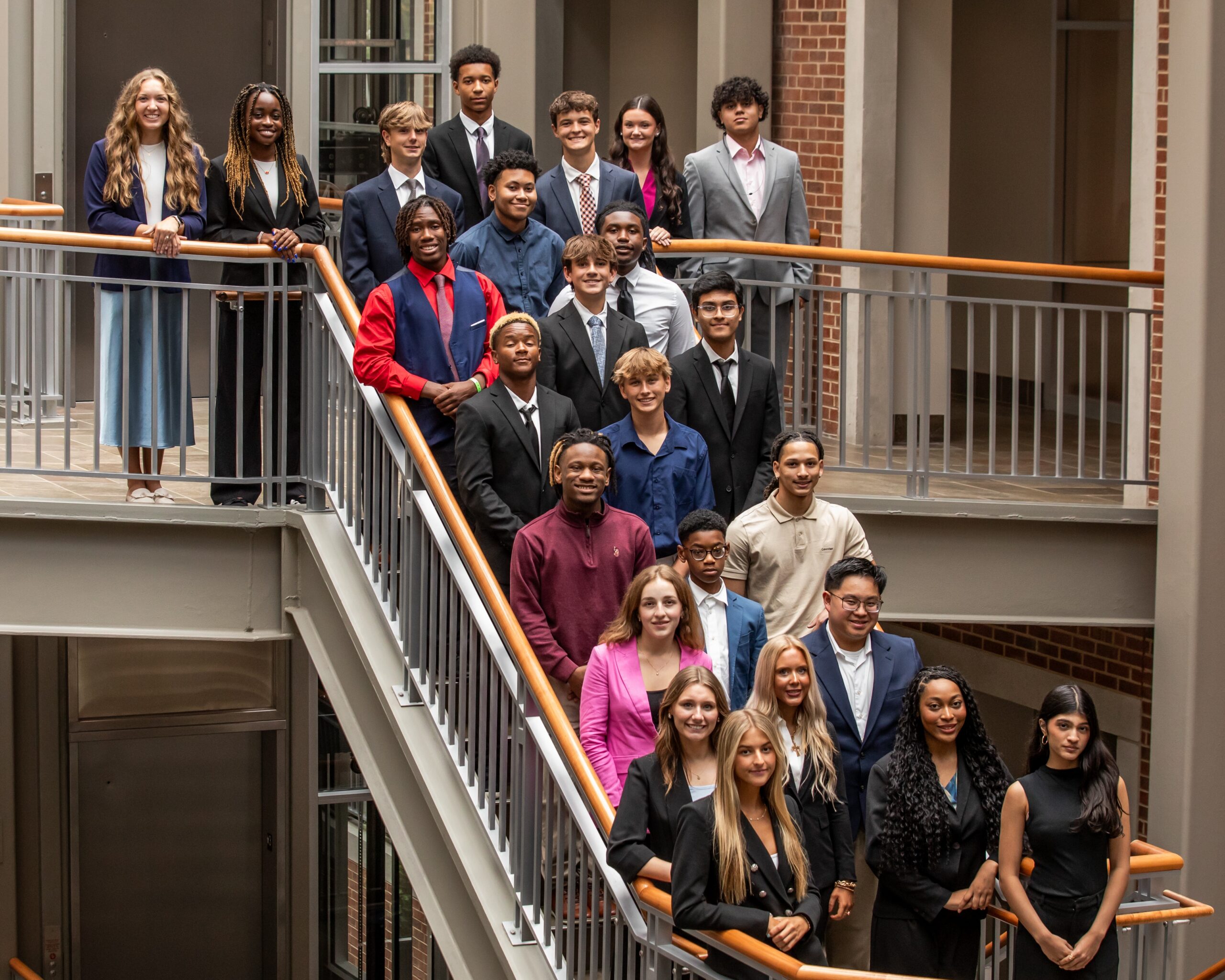SCM Program students on stairs