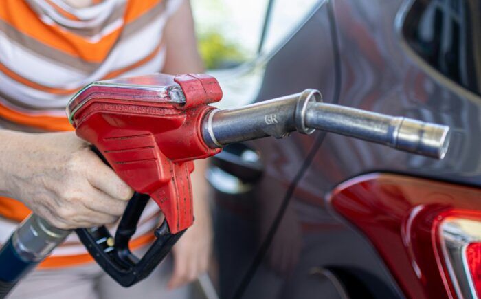 Close-up of someone pumping gas